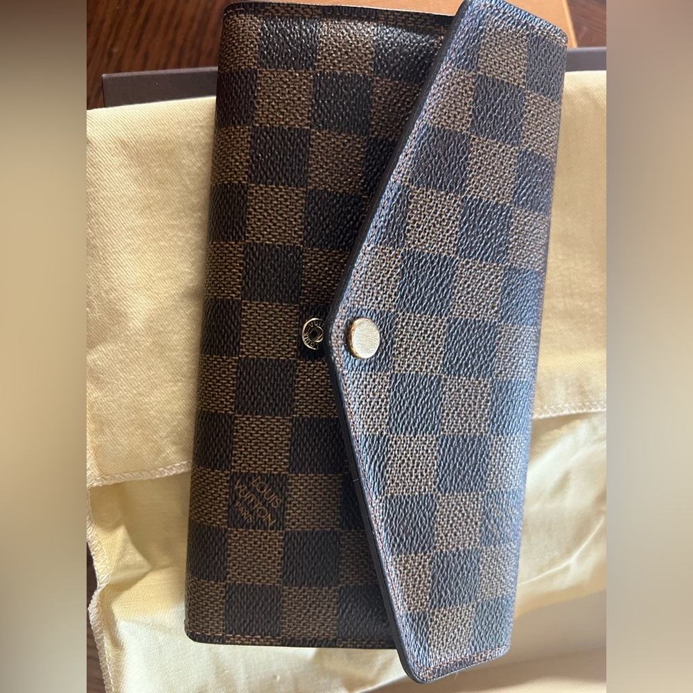 Authentic like new Louis Vuitton Sarah wallets with initials IS
